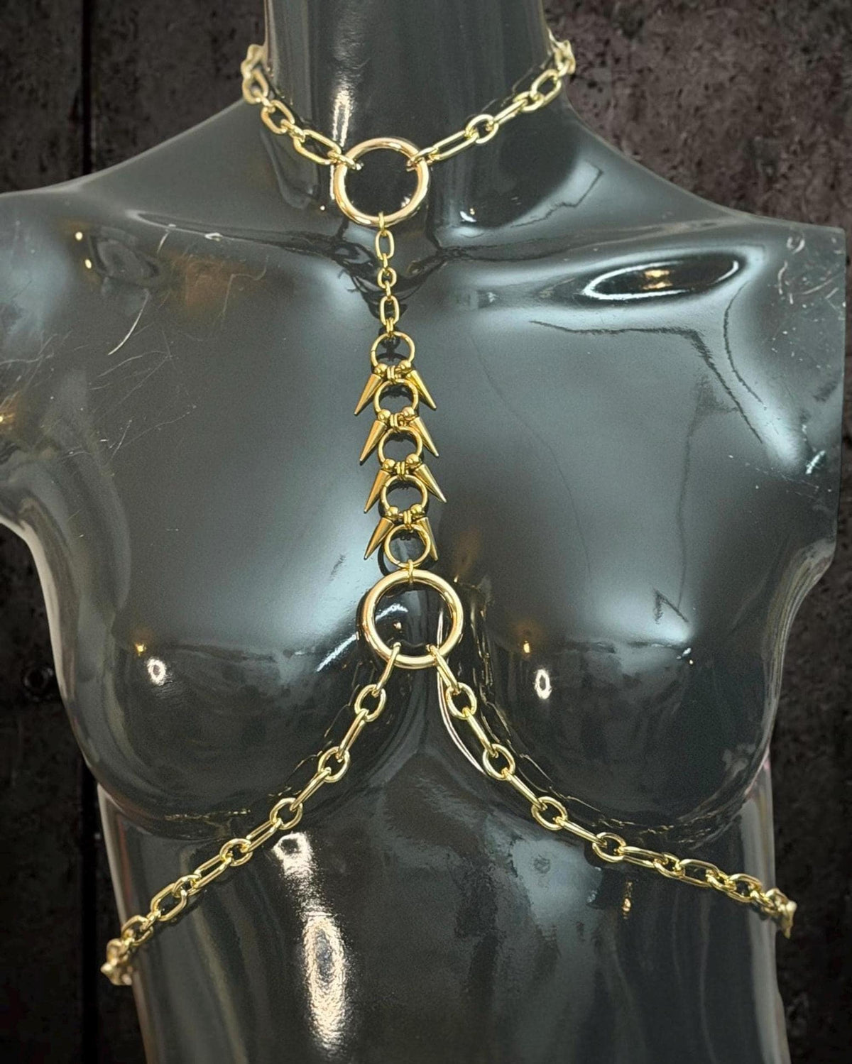 Gold gothic body jewelry front detail, chained throat to waist rings with bold spike-like links