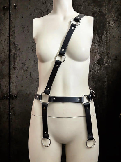 Minimal crossbody-to-thigh strap, convertible leather harness styled for punk and techno outfits