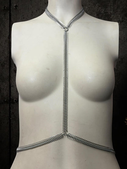 White mannequin frontal with spine body chain, skeletal Y silhouette in polished stainless steel gothic body jewelry