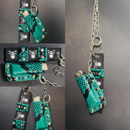 Spread layout of two turquoise snakeskin accessories, skull webbing and long chain, alternative fashion keychain set