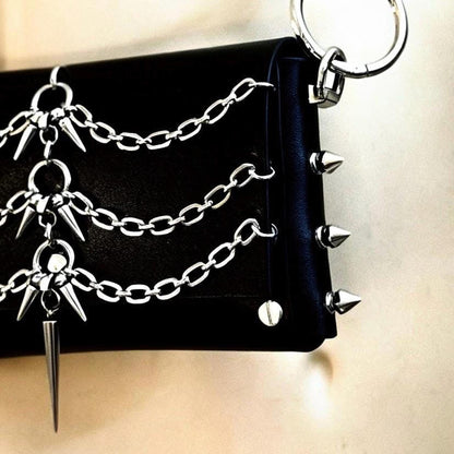 Tight detail of central spike, layered chains and rivets, showing 3mm Italian vegetable tanned leather