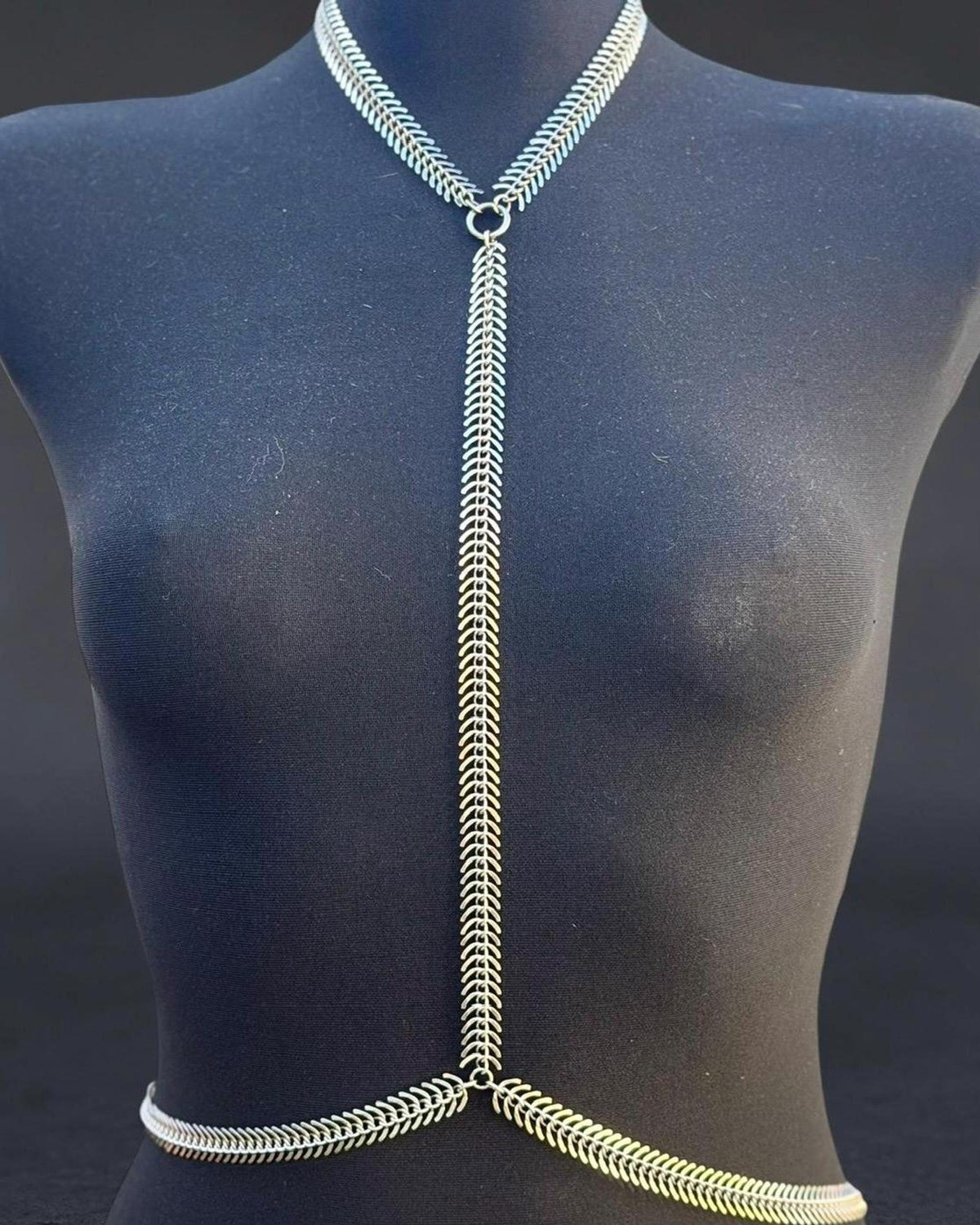 Tight torso crop with spine body chain centered, durable water-resistant stainless steel alternative body harness