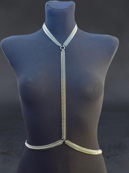 Close-up blue mannequin, spine body chain with vertebrae-inspired links, adjustable stainless steel spine harness