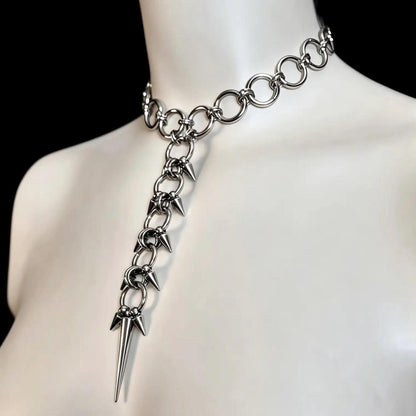 Side neck angle on mannequin, dramatic long lariat pendant and layered spikes, gothic choker necklace, spiked spine necklace.