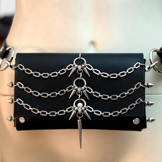 Close front detail of spiked leather crossbody bag, black 3mm leather, layered silver chains and central spike